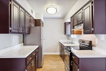 Upgraded white or mocha cabinets - in select apartments
